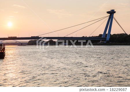 SNP bridge across Danube river in early morning SNP bridge across Danube river in early morning 18229087