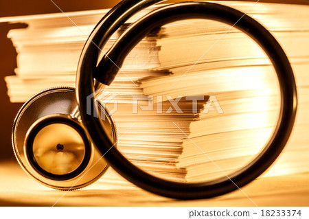 Stethoscope and heap of paper cards Stethoscope and heap of paper cards 18233374