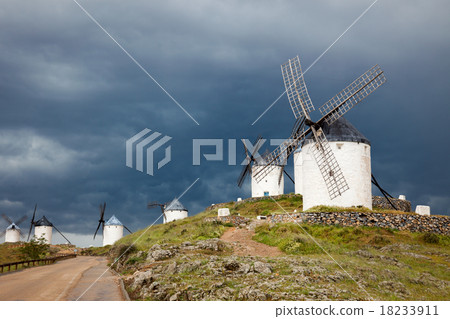 Old  windmills on dramatic sky and rainy weather 18233911