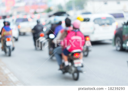 car and motorcycle driving on road with traffic car and motorcycle driving on road with traffic 18239293