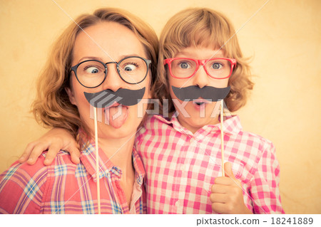 Mother and child with fake mustache Mother and child with fake mustache 18241889