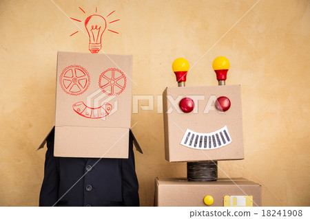 Young businessman with robot Young businessman with robot 18241908