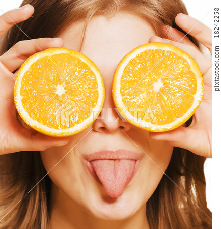young pretty girl with orange close up young pretty girl with orange close up 18242258