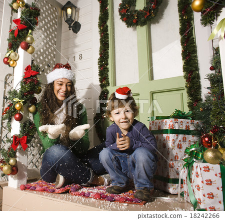 happy family on Christmas in red hats waiting happy family on Christmas in red hats waiting 18242266