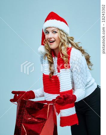 Beautiful young woman in Santa Claus clothes Beautiful young woman in Santa Claus clothes 18243302