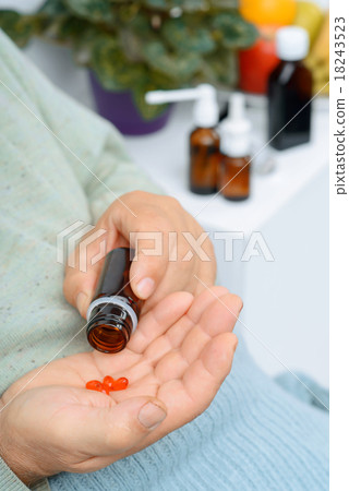 Old man takes out a few pills of remedy. Old man takes out a few pills of remedy. 18243523