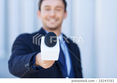 Affable newsman is listening to the interviewed. Affable newsman is listening to the interviewed. 18243581