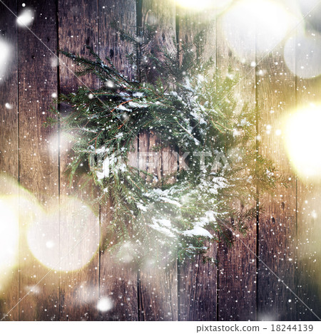 Wreath on Wooden Background with Falling Snow Wreath on Wooden Background with Falling Snow 18244139