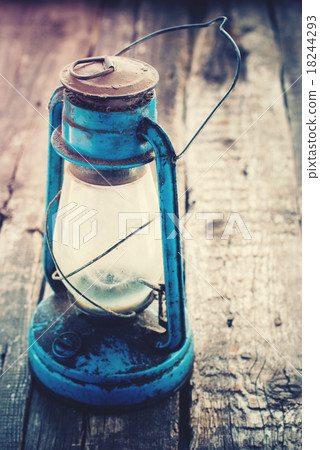 Vintage Dirty Blue Oil Lamp on Wooden Background 18244293