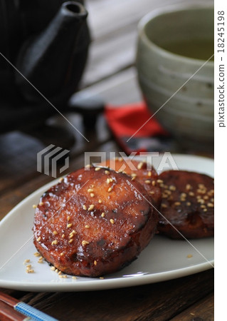Handmade pumpkin dumplings with sugar and soy sauce, iron kettle and green tea Handmade pumpkin dumplings with sugar and soy sauce, iron kettle and green tea 18245198