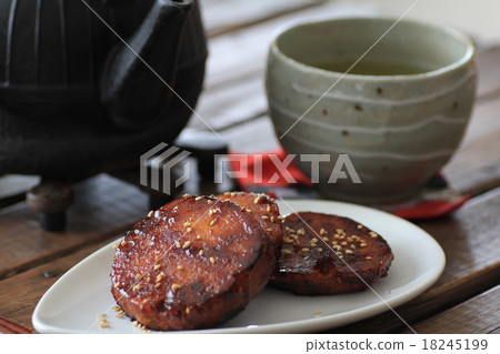 Handmade pumpkin dumplings with sugar and soy sauce, iron kettle and green tea Handmade pumpkin dumplings with sugar and soy sauce, iron kettle and green tea 18245199