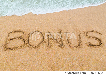 BONUS inscription written on sandy beach with wave BONUS inscription written on sandy beach with wave 18248634