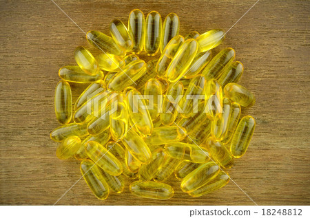 Soft gelatin capsule medicine on wood background. Soft gelatin capsule medicine on wood background. 18248812