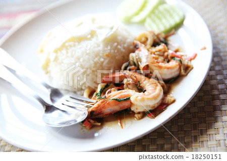 Sea food with basil and egg served with rice Sea food with basil and egg served with rice 18250151