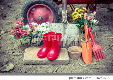 gardening tool including by red boots vase , fork , shovel and b gardening tool including by red boots vase , fork , shovel and b 18250790