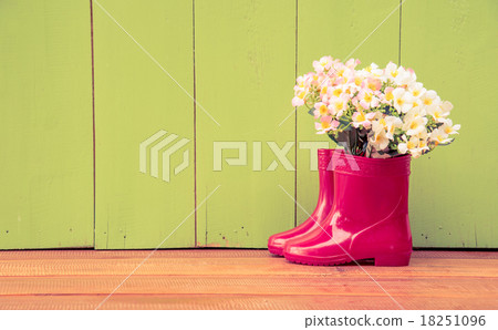 red color children boot and flower basket put on the wood floor red color children boot and flower basket put on the wood floor 18251096
