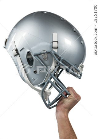 Close-up of American football player handing his sliver helmet 18251700