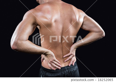 Shirtless man with back pain 18252065