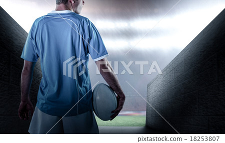Composite image of rugby player holding a rugby ball Composite image of rugby player holding a rugby ball 18253807