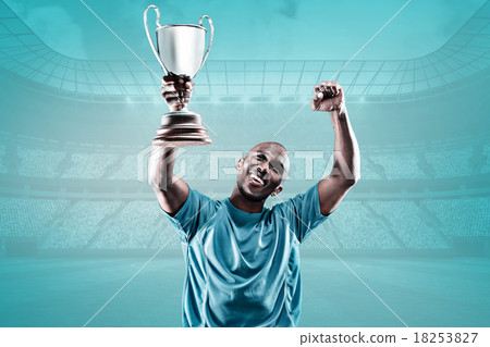 Composite image of happy sportsman looking up and cheering while Composite image of happy sportsman looking up and cheering while 18253827
