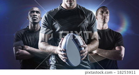 Composite image of thoughtful rugby player holding ball 18253911