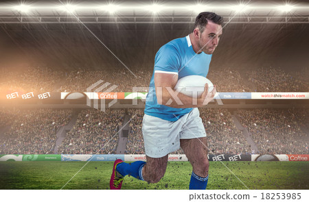 Composite image of rugby player running with the ball Composite image of rugby player running with the ball 18253985