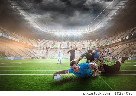 Composite image of rugby player doing a drop kick 18254083