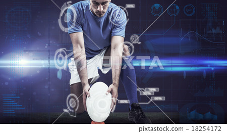 Composite image of full length of rugby player placing ball 18254172