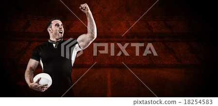 Composite image of rugby player cheering with the ball 18254583