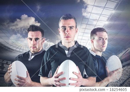 Composite image of tough rugby players Composite image of tough rugby players 18254605