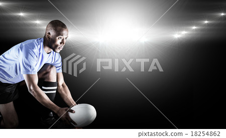 Composite image of rugby player looking away while keeping ball Composite image of rugby player looking away while keeping ball 18254862