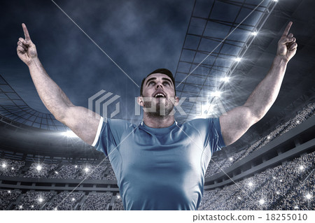 Composite image of rugby player cheering and pointing Composite image of rugby player cheering and pointing 18255010