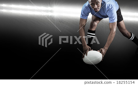 Composite image of portrait of sportsman bending and holding bal Composite image of portrait of sportsman bending and holding bal 18255154