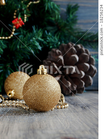 Christmas decorations on a background of trees and Christmas decorations on a background of trees and 18256234