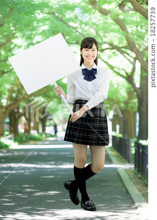School girls in uniform with their fresh green tree lined avenues 18257739