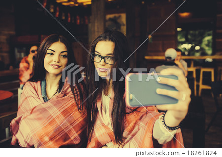 two close friends do selfie in the cafe two close friends do selfie in the cafe 18261824