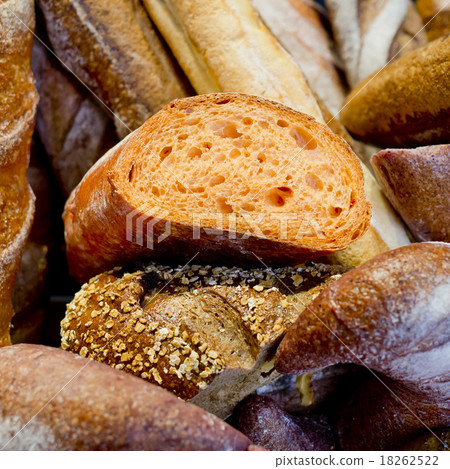French bread baguettes in wooden box. French bread baguettes in wooden box. 18262522