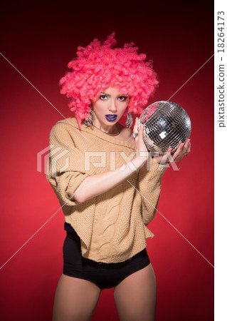 Pink party girl holding silver ball Pink party girl holding silver ball 18264173