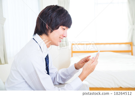 Male businessman mobile phone handset search information on handset information background white background internet FX game Male businessman mobile phone handset search information on handset information background white background internet FX game 18264512