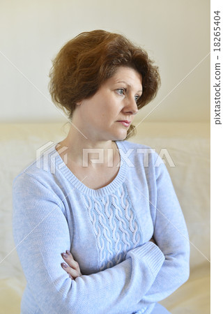Sad woman looking away at home in  living room 18265404