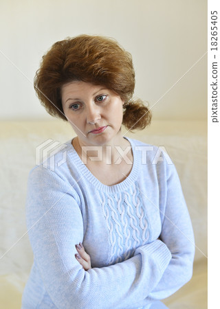 Sad woman looking away at home in  living room 18265405