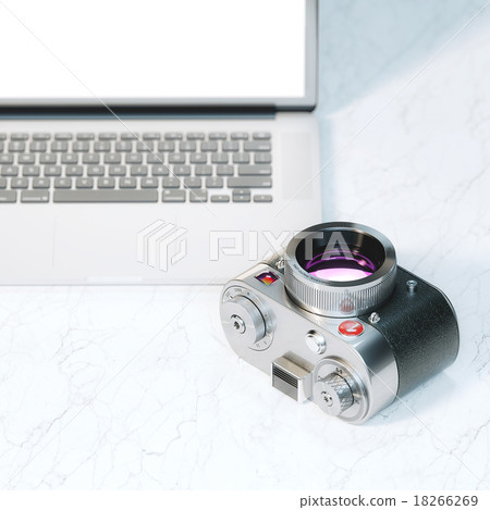 Vintage photo camera and laptop 18266269