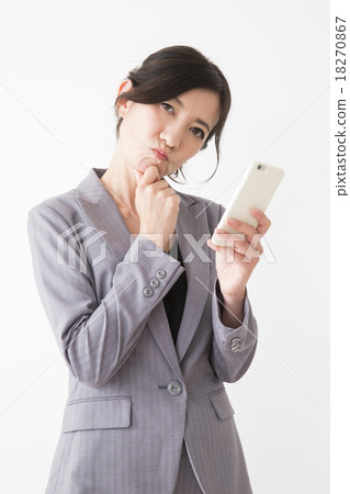 Middle women in suits to operate smartphones Middle women in suits to operate smartphones 18270867
