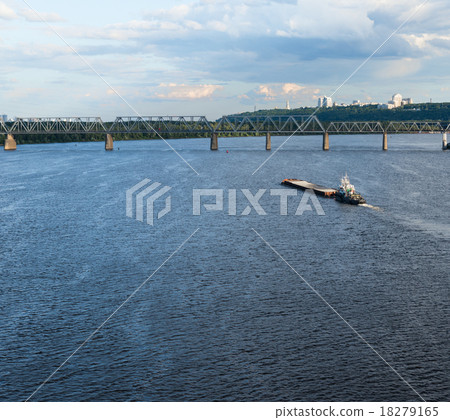The barge floating in the blue Dnieper waters 18279165