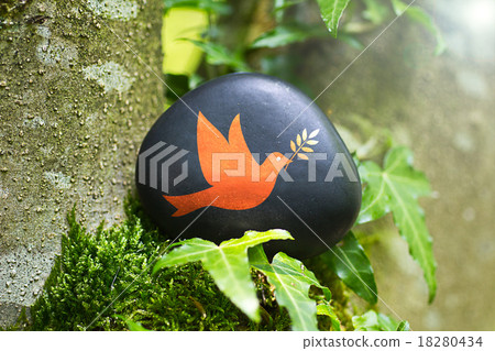 The Dove of Peace on a stone in nature The Dove of Peace on a stone in nature 18280434