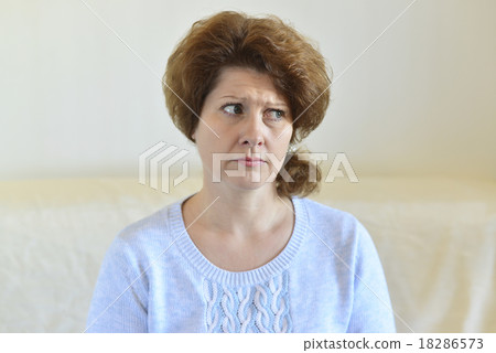 Sad woman looking away at home in  living room 18286573