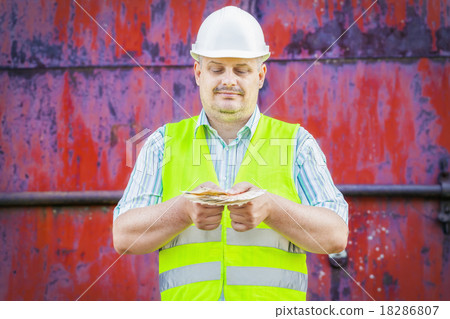 Worker with euro banknotes Worker with euro banknotes 18286807