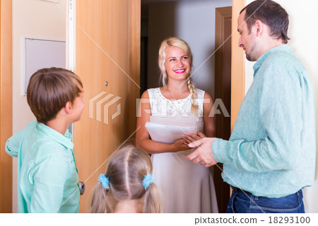 Inspector greeting family of new tenants Inspector greeting family of new tenants 18293100
