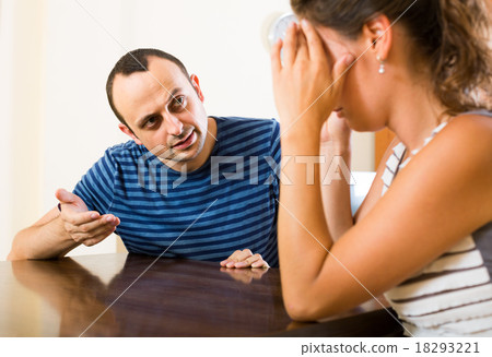 family couple shouting while arguing indoors family couple shouting while arguing indoors 18293221