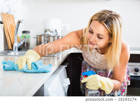 Woman washing kitchen top 18293274